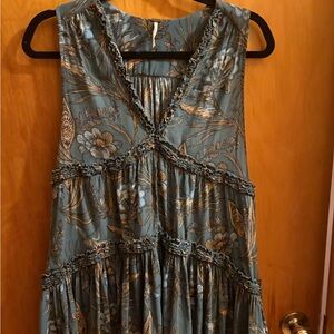 Free people haze hummingbird top in teal blue with a floral and paisley print